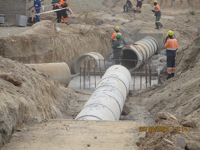 Reinforced concrete stormwater pipes being laid at the Mbudzi Interchange